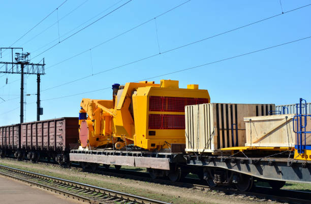 istock Logistics transportation heavy mining dump truck by rail. 1197232291