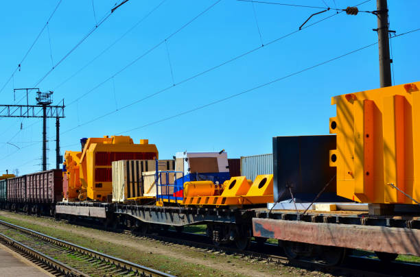 istock Logistics transportation heavy mining dump truck by rail. 1197232336