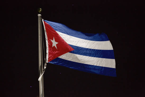 istock Cuba flag blowing in the wind at night 1197232364