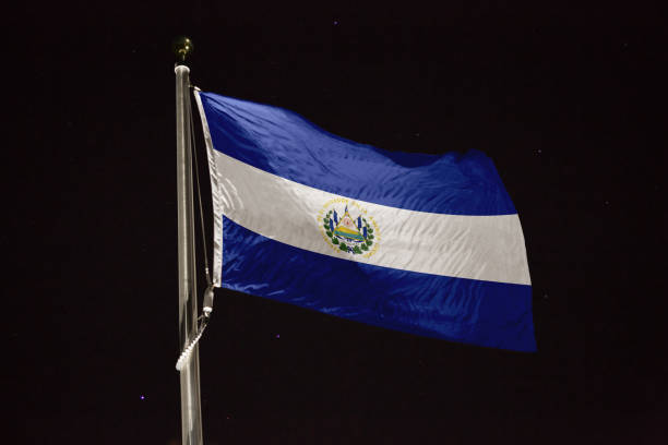 istock El Salvador flag blowing in the wind at night 1197233096