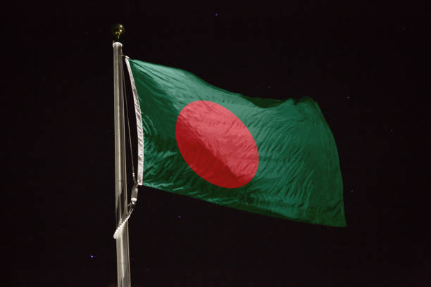 istock Bangladesh flag blowing in the wind at night 1197234002
