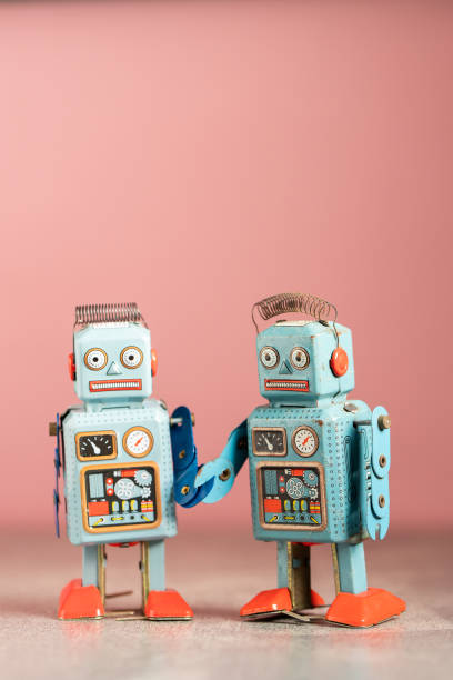 istock Vintage robot tin toy on pink background 1197235013