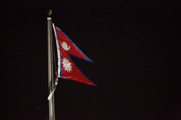 istock Nepal flag blowing in the wind at night 1197236052