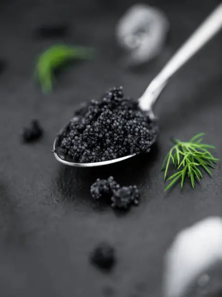Portion of Black Caviar as detailed close-up shot; selective focus
