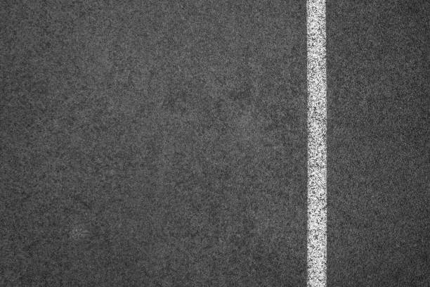 istock Asphalt road with marking lines white stripes texture Background. 1197239513