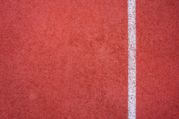 Running track red ground rubber cover texture background.