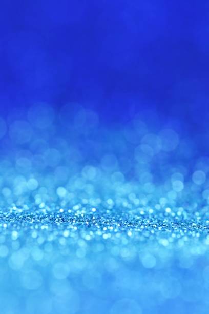 istock Blue background with light blue shining bokeh.panton 2020 classic blue.glitter blue gradient texture with bokeh. classic blue swatch for print, web design 1197240448