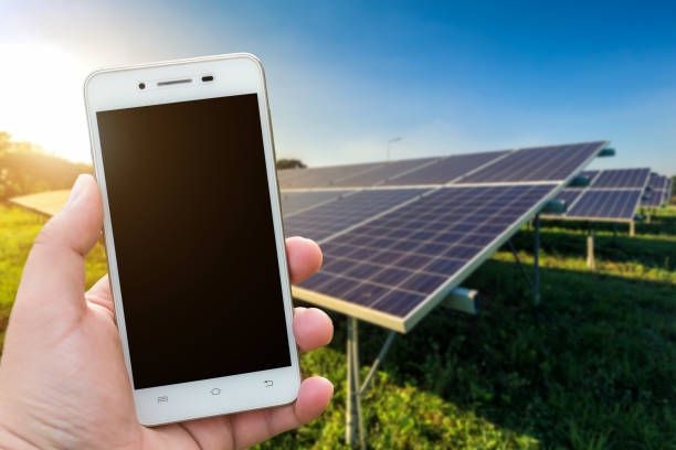 istock Men use smartphone blurred images in the solar panel background. As Renewable Energy and clean energy. 1197244760