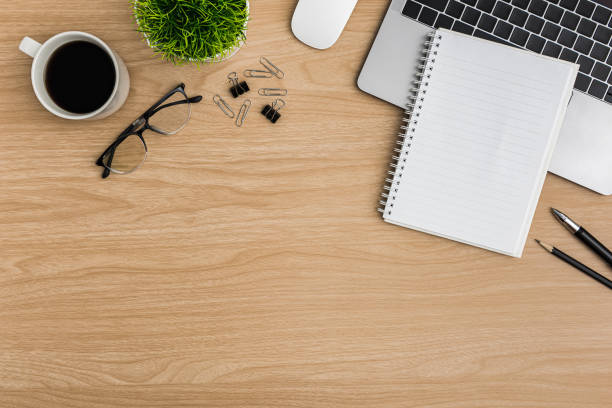 istock Top view Wood office desk table. Flat lay Workspace 1197246480