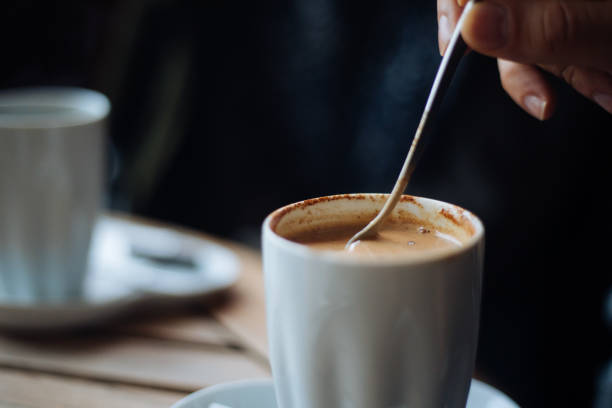 istock Man mixing a cup of coffee 1197250305