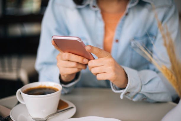 istock Woman using smartphone close up 1197252315