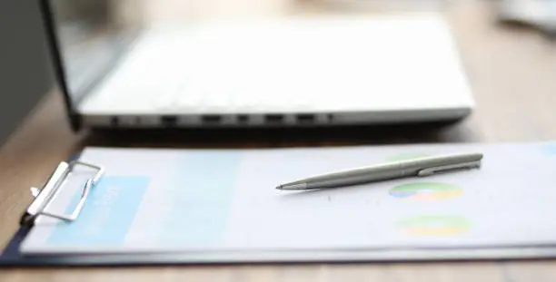 Photo of Close-up of significant charts and graphs lying on table