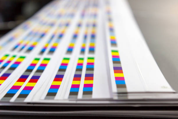 istock CMYK color bars on printed sheets of paper 1197255520