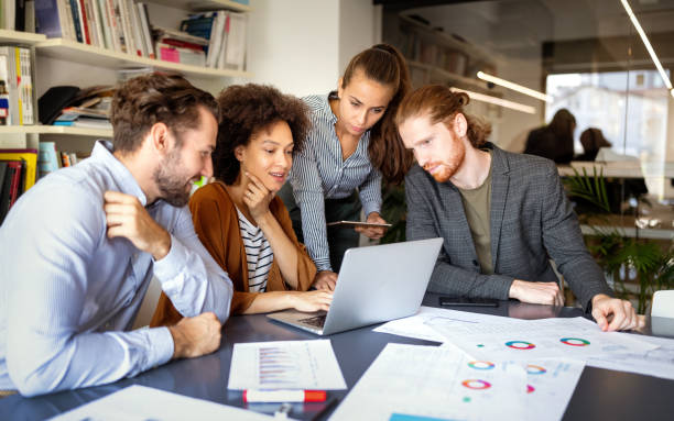 istock Group of business people collaborating on project in office 1197257610