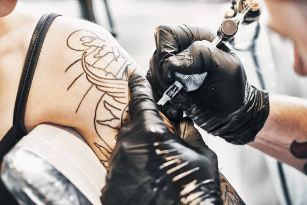 istock Tattooing a shoulder. Close-up shot 1197257873