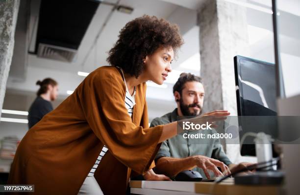 Programmers Cooperating At It Company Developing Apps Stock Photo - Download Image Now