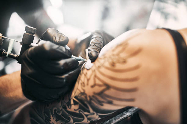 istock Tattooing a shoulder. Close-up shot 1197258115