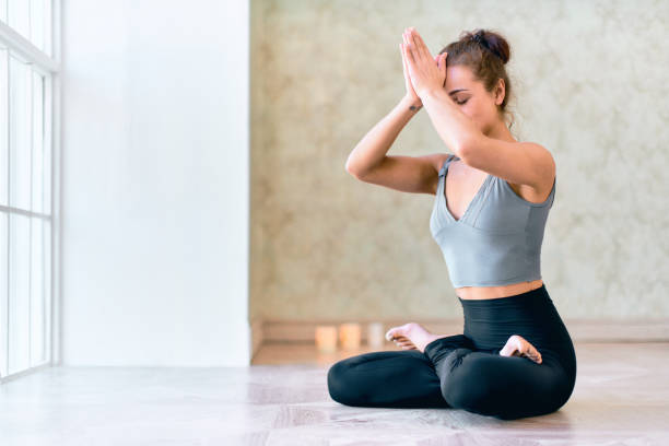 istock Cute Woman Doing Padmasana 1197258702
