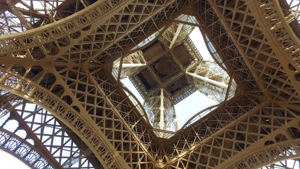istock Vview to top of Eiffel tower from under the Paris landmark 1197259201