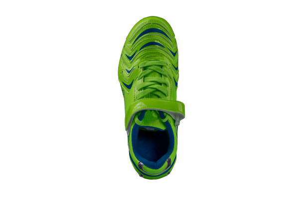 istock Green glossy sneaker on a white background. Sport shoes 1197259212