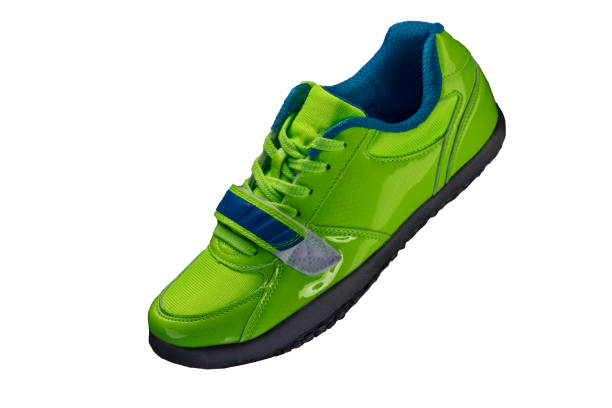 istock Green glossy sneaker on a white background. Sport shoes 1197259273