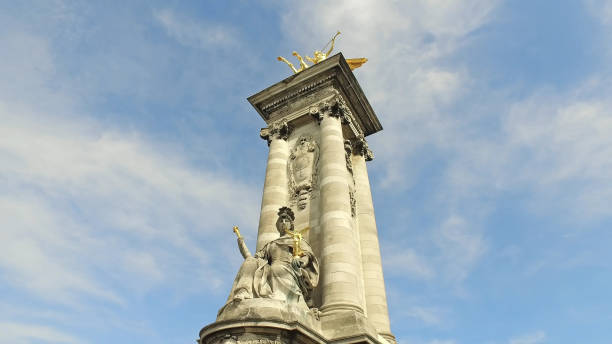 istock Paris Alexander III Bridge, Golden Statue Closeup View on a Blue Sky 1197259383
