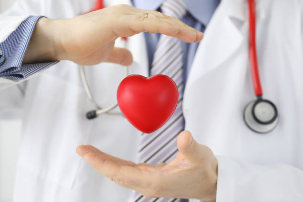 istock Mans hands holding red heart 1197259533