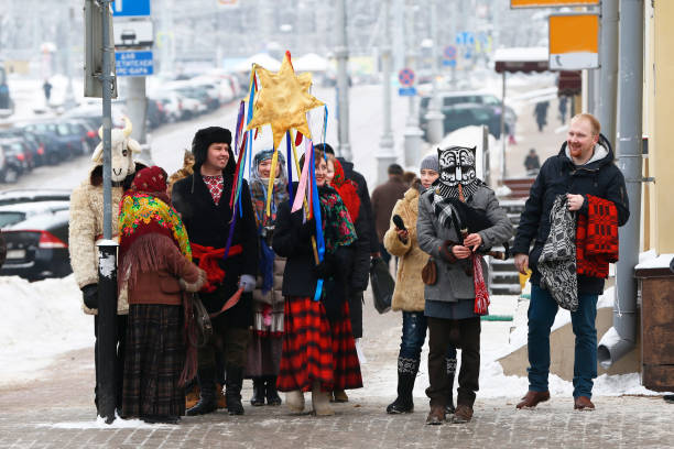 Belarus, Gomel, January 13, 2017. Central District. Russian ceremony of Kalyada. A group of people go to lavish with a Christmas star, a goat, in national costumes.To go round carol-singing in a goat costume