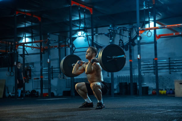 istock Caucasian man practicing in weightlifting in gym 1197262191