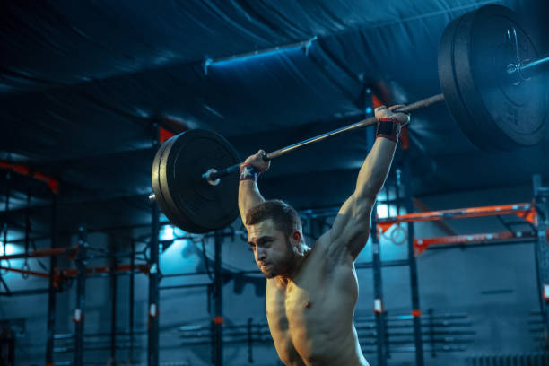 istock Caucasian man practicing in weightlifting in gym 1197262192