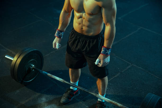 istock Caucasian man practicing in weightlifting in gym 1197262234
