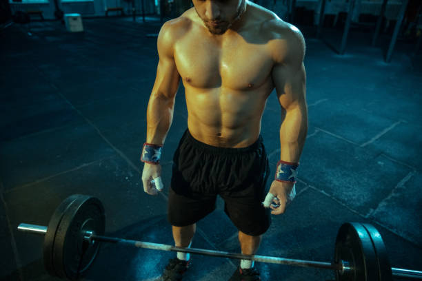 istock Caucasian man practicing in weightlifting in gym 1197262236