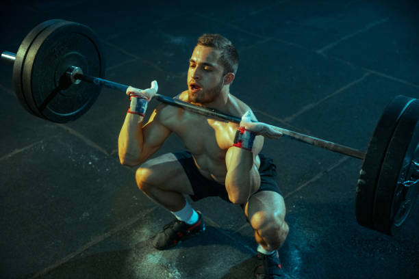 istock Caucasian man practicing in weightlifting in gym 1197262749