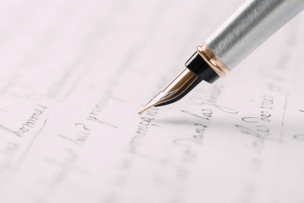 istock Fountain pen on an ancient handwritten letter. Old story. Retro style. 1197263199
