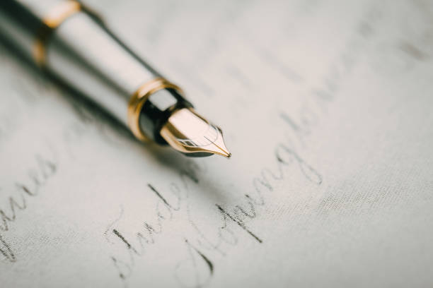 istock Fountain pen on an ancient handwritten letter. Old story. Retro style. 1197263241