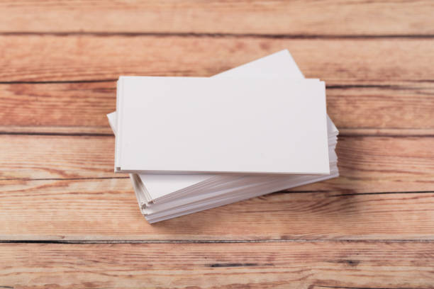 istock empty white business cards on a light natural wooden background 1197263252
