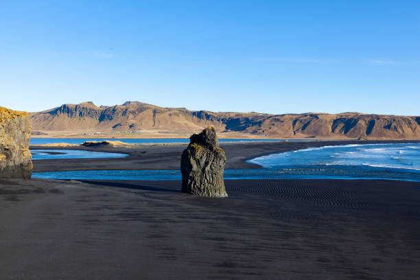 istock arnardrangur rock, black sand beach, iceland 1197268246