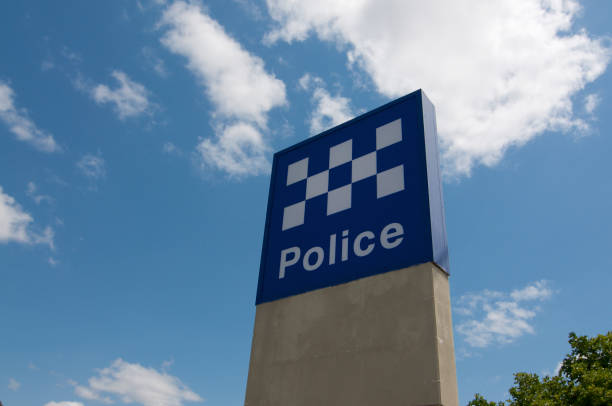 Brisbane, Queensland, Australia - 29th October 2019 : View of the australian Police sign against a blue sky located outside a police station in Greenslopes, Brisbane, Australia