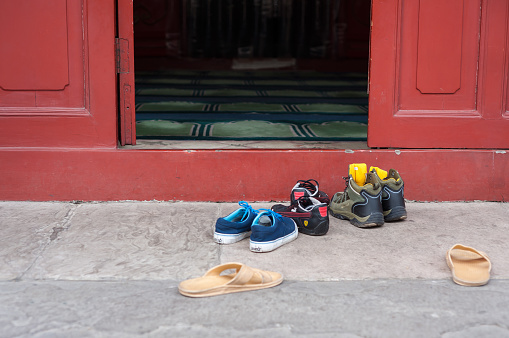 BEIJING, CHINA - DEC 27, 2013 - Removed footwear outside the main prayer hall at the Cow Street Mosque, Beijing, China