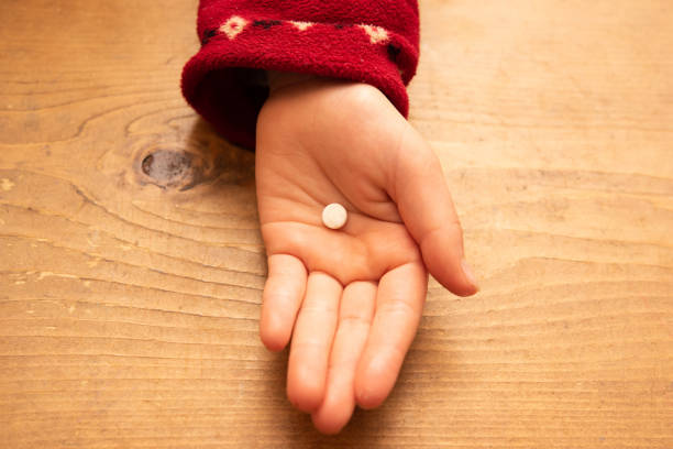 istock Child's hand holding a tablet 1197269739