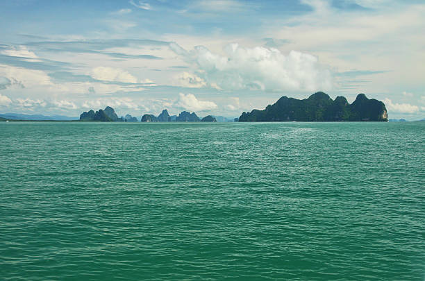 Phang Nga Bay, Thailand Phang Nga is a bay in the Andaman Sea between the island of Phuket and the mainland of the Malay peninsula of southern Thailand. Since 1981 a big part of the bay is protected as the Ao Phang Nga National Park. Image processed using HDR effect phang nga province stock pictures, royalty-free photos & images