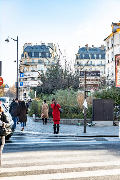 2019 The River Seine Pont St Louis bridge entry near Notre Dame in Paris with a zebra crossing in the foreground.