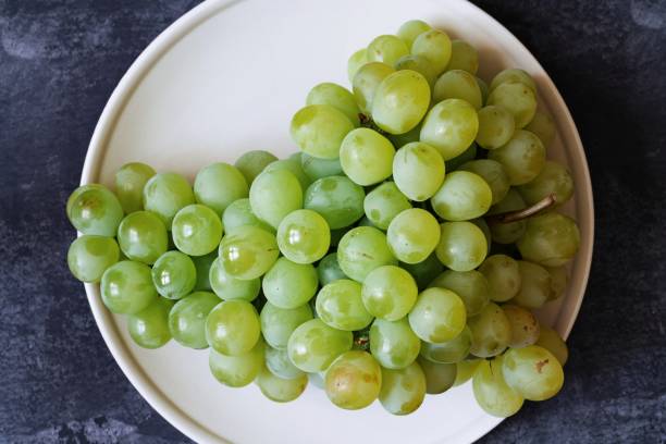 istock Bunch of green grapes closeup 1197272483