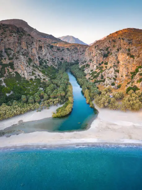 Famous Preveli gorge with river and palm tree forest (South Chania, Crete, Greece). View from the sea.