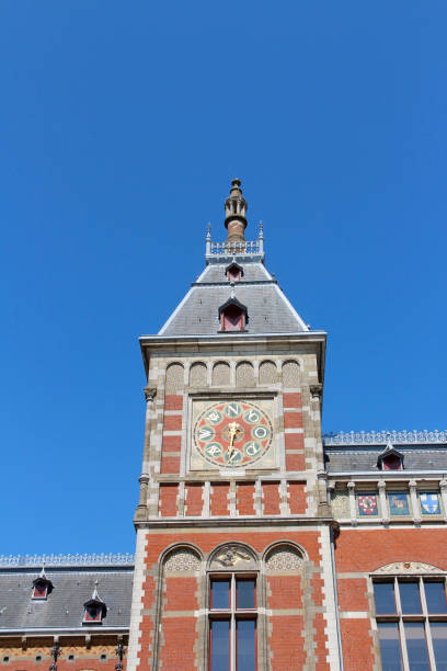 Front view of the Amsterdam Central (Centraal) Railway Station in a sunny day, Netherlands