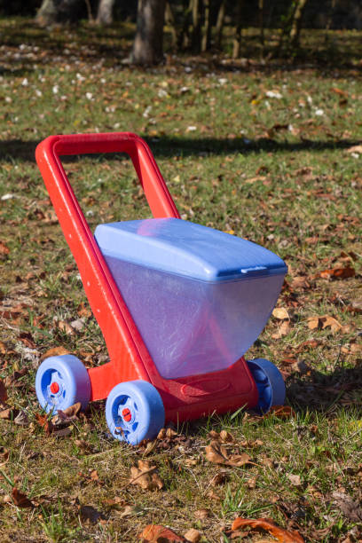 istock Red and blue wheelbarrow in plastic 1197276117