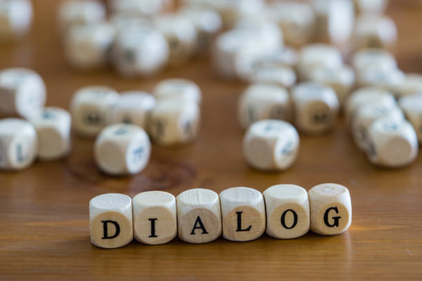istock Dialog written with wooden cubes 1197281260