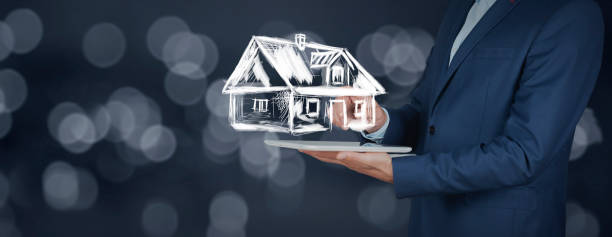 istock man hand tablet with house network in screen 1197282926