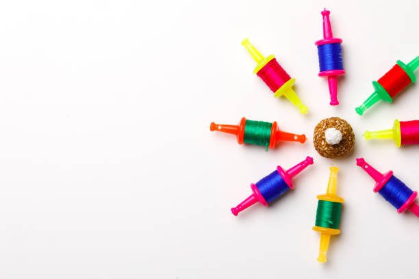 istock Indian festival makar sankranti concept, Kite String with Sesame seed ball or til ke laddo 1197283348