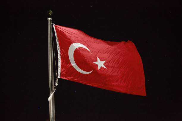 istock Turkey flag blowing in the wind at night 1197283931